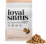 Loyal Saints premium freeze-dried turkey pet food packaging with some food on a white background
